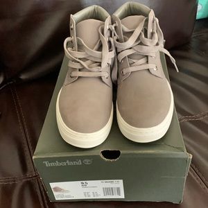 I have a brand new pair of women’s grey Timberlands size 9.5.
